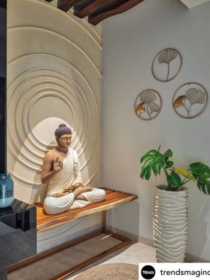 A serene meditation corner featuring a Buddha statue on a wooden bench. The space is enhanced by a textured circular backdrop and soft, focused lighting.