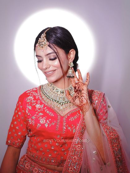 This shot highlights the intricate details on the blouse and the beautiful jhumkas. We have a wide range of jewellery to match any bridal outfit you choose.