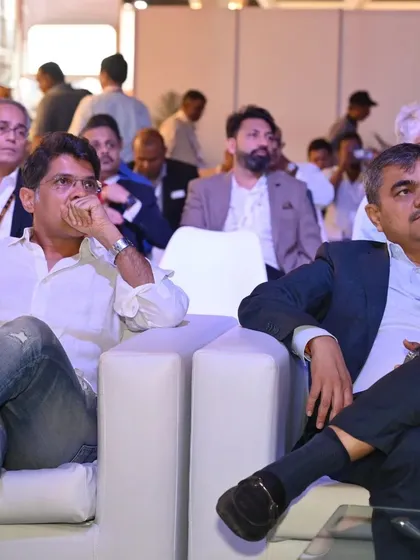 Two attendees engrossed in a conference session, highlighting the valuable educational content and thought leadership presented at the Smart Home Expo.