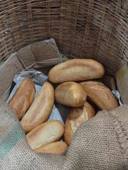 The foundation of a great Bánh Mì is the bread. Freshly baked baguettes, with a thin, crisp crust and a soft interior, waiting to be filled.