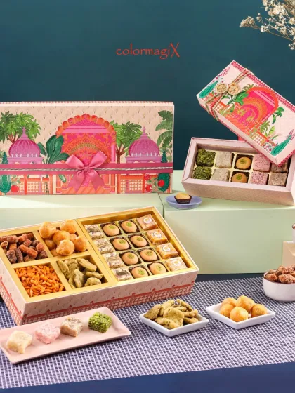 This elegant hamper features a stunning palace-themed design. It opens to reveal a delightful assortment of traditional sweets, savory snacks, and premium dry fruits, perfect for sharing with family.