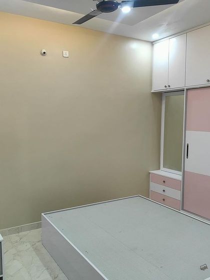 The bedroom for a younger family member, featuring a custom bed, study unit, and wardrobe, all designed to create a cohesive and functional space.