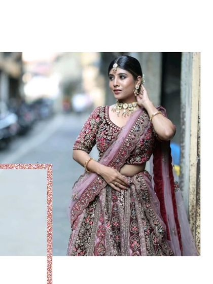 A beautiful portrait of a bride in our deep wine-colored velvet lehenga. The craftsmanship and fit are designed to make you look flawless from every angle.