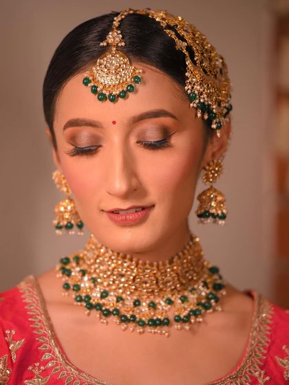 It's all in the details. A close-up from a bridal campaign, showing the detailed eye makeup with a pop of blue liner and a perfectly blended base.