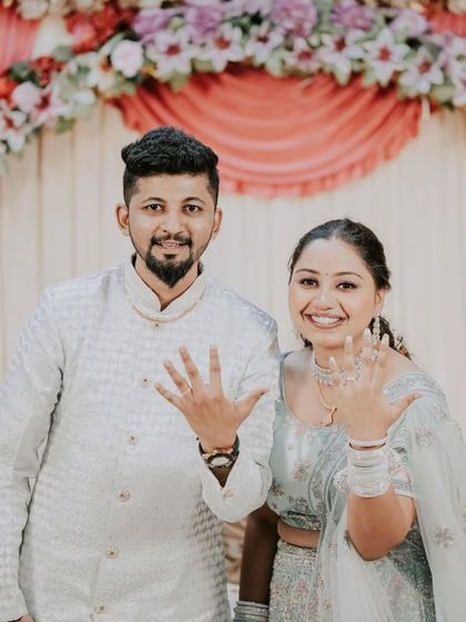 The classic "we're engaged" photo! A happy, direct-to-camera shot where the couple proudly shows off their new rings is a must-have for every engagement album.