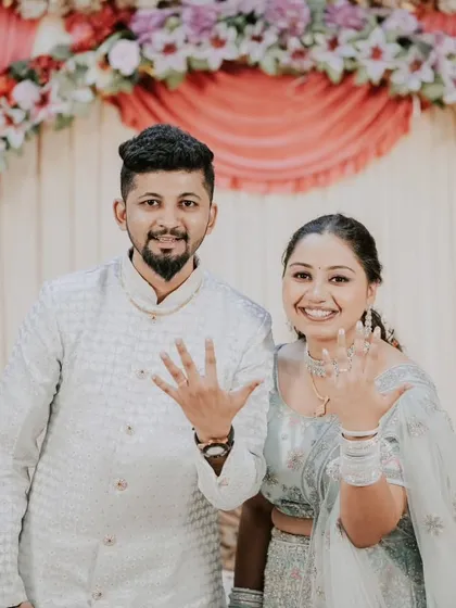 The classic "we're engaged" photo! A happy, direct-to-camera shot where the couple proudly shows off their new rings is a must-have for every engagement album.