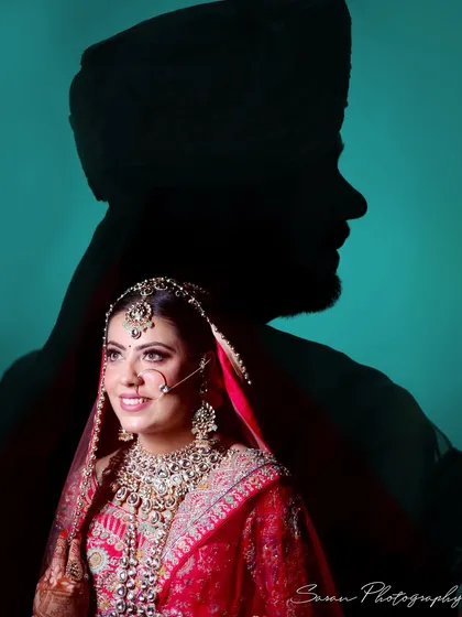 An artistic double exposure portrait, overlaying the groom's silhouette on a beautiful shot of the bride.