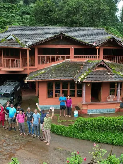 A group photo in front of a beautiful, large homestay in Coorg. This is where we rest and recharge after a day of trekking.