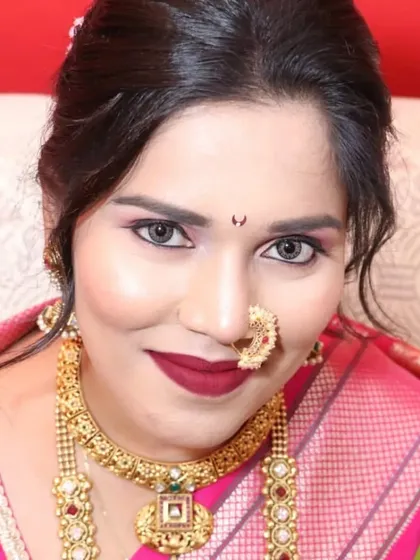 A close-up portrait showcasing the intricate details of the necklace and the traditional Maharashtrian nath (nose ring).