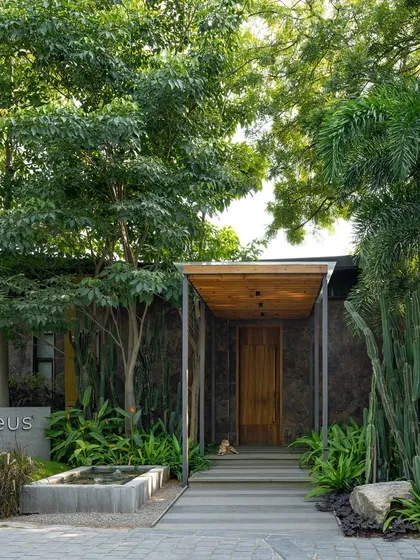 The entrance to the KEUS office, recognized by Work Design Magazine for its serene Japanese Garden-inspired landscape. The design balances stone, wood, water, and carefully selected plants to create a calm and welcoming entry.
