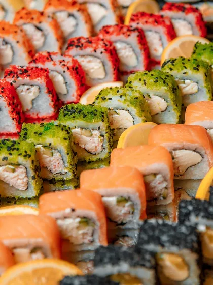 A vibrant and colorful platter of assorted sushi, demonstrating our expertise in Pan-Asian cuisine. Each roll is a testament to our dedication to freshness and authentic flavor, perfect for adding a touch of international sophistication to any wedding or corporate event.