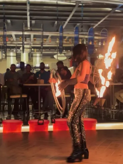 To make your event truly unique, I often collaborate with other talented performers. Here, a fire dancer adds a spectacular visual element to my set, creating a multisensory experience for the guests.