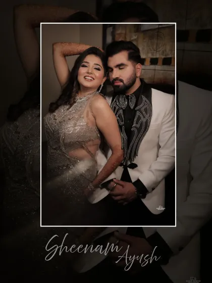 A fun and glamorous shot of the couple. The bride's pose exudes confidence and joy, perfectly complementing the groom's stylish look.