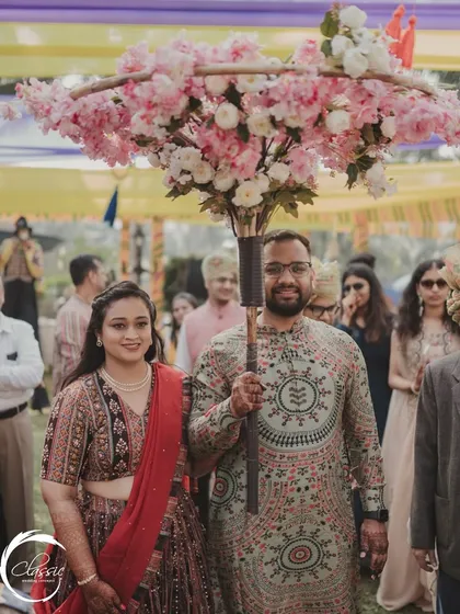 A unique twist on the traditional floral entry. I designed this 'phoolon ki chadar' as an umbrella, creating a beautiful and memorable prop for the couple's entrance.