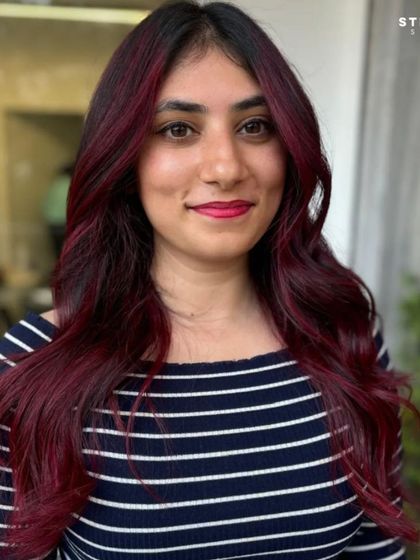 A happy portrait of the client, her smile as vibrant as her hair.