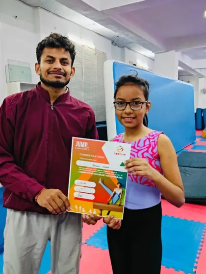 This student is excited to receive her "JUMP" certificate for her achievements.