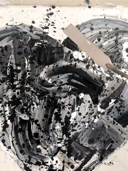 A textured, abstract heart painting in black and white, created with a palette knife. This piece explores the shades of grey in life and taking radical responsibility for our experiences.