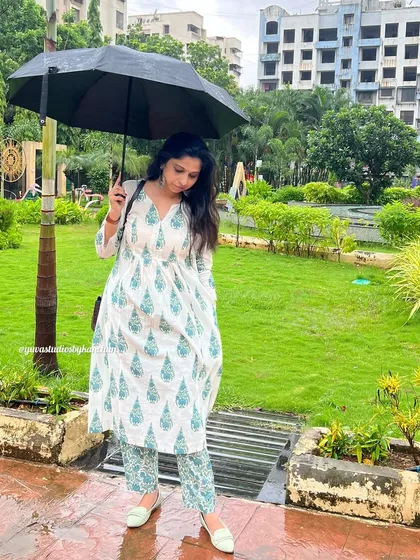 Launching a new style you will love. This white and green printed kurta-pant set is made from pure cotton and is perfect for a rainy day stroll.