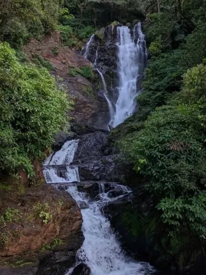 The cascading beauty of Vibhuthi waterfalls, a must-visit spot for its natural pools and serene surroundings.