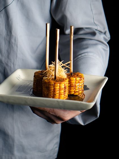 This is our take on Japanese corn. Our Shiso Butter Corn is glazed in butter with shiso and paprika, then skewered for easy enjoyment.
