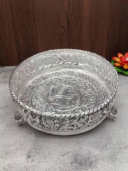 A clear shot of the antique German silver urli with elephant legs, a perfect centerpiece for any festive decor.