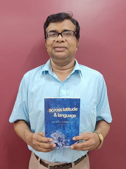 A proud participant from our World Poetry Project holds his copy of the anthology. It is an honor to connect poets globally and bring their work together in a single, powerful collection.