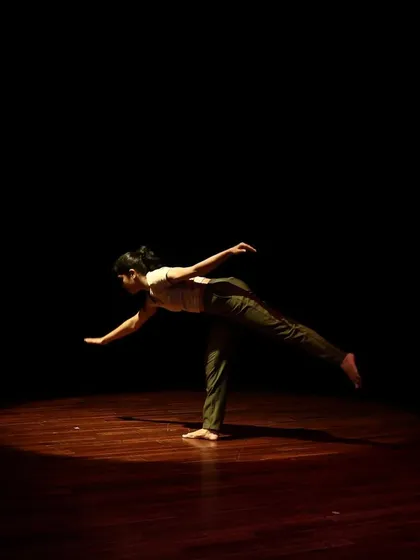 A dancer balances gracefully in a contemporary piece from the Parabola of Dance series.