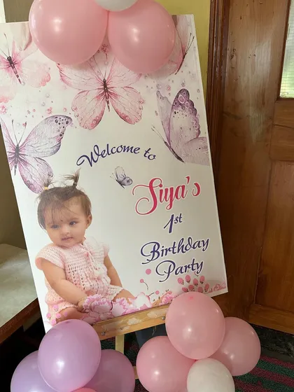 A personalized welcome sign for a butterfly-themed first birthday party. This is a great way to greet guests and set the theme from the very beginning.