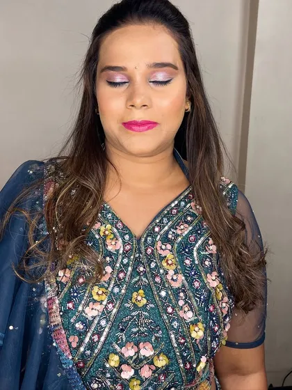 A close-up of Nikita's sangeet makeup. The purple and pink shimmer on the eyes adds a fun, celebratory touch.