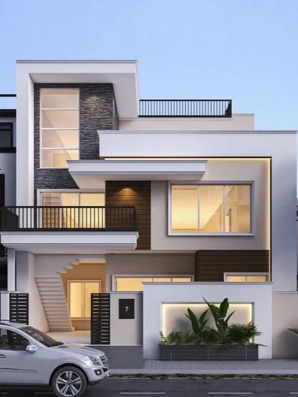 A clean and contemporary residential exterior design featuring a geometric composition of interlocking white volumes. The strategic use of dark stone, wood accents, and an integrated planter box at the entrance creates a welcoming and modern first impression.