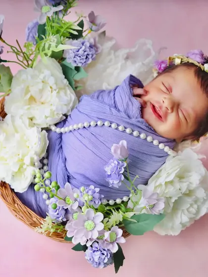 A heart-melting smile from a sleeping baby in the purple floral basket. It’s these fleeting expressions that make every photo unique.