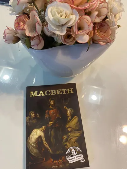 A copy of Macbeth. We believe in making even complex concepts like Shakespeare and post-dramatic theatre accessible and engaging for our students, tapping into their creativity in unconventional ways.