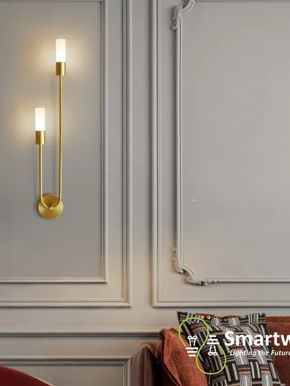 This elegant U-shaped wall sconce in a gold finish is perfect for adding a touch of luxury to a formal living room or hallway. The design is inspired by classic candle holders but with a modern twist.