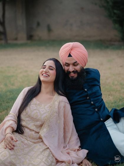 A candid moment of laughter and ease during a portrait session in the quiet lanes of Amritsar. We aim to create a relaxed atmosphere where couples can be themselves, resulting in genuine and joyful photos.