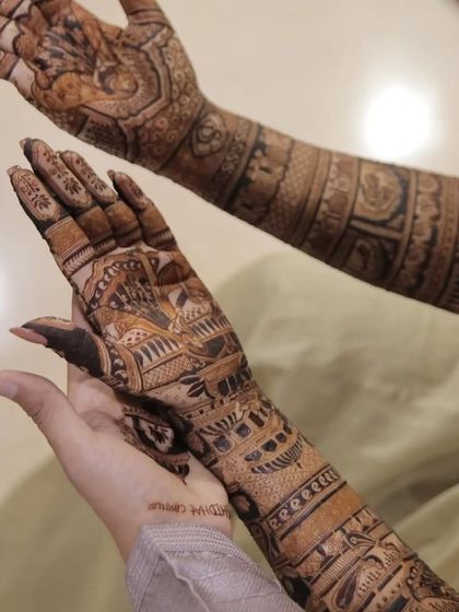 A close-up of the applied mehandi, showing the fine lines and detailed work before the paste is removed.
