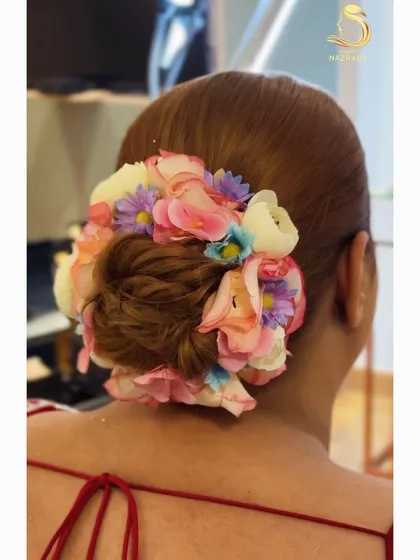 Another view of the colorful floral bun, showing the beautiful blend of pastel flowers.