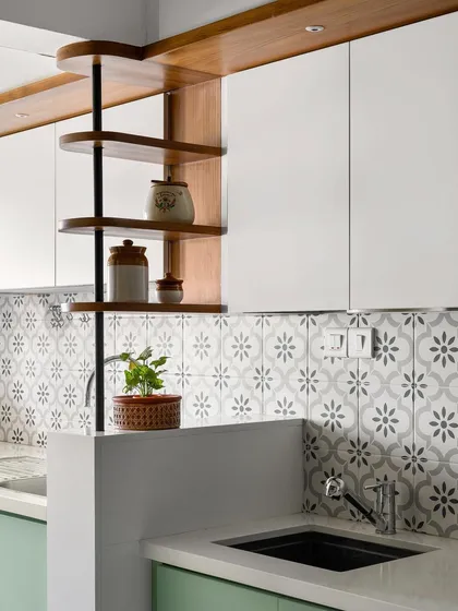 This unique rotating shelf provides clever corner storage while separating the wet and dry areas of the kitchen, demonstrating our focus on innovative and practical design solutions.