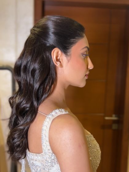 A profile shot of the finished look, showcasing the beautiful, uniform waves.