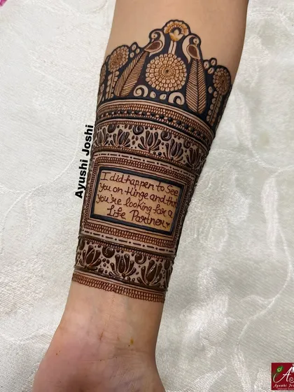 A detailed view of the forearm, showcasing the handwritten quote from a Hinge conversation that started their journey.