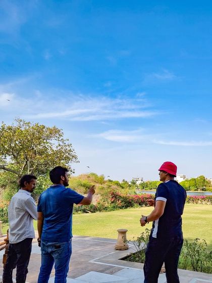 The planning process always starts with a site visit, or 'recce'. Here, my team and I are surveying the beautiful lawns of Udaivilas, visualizing how we will transform the space for the upcoming wedding.