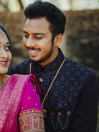 A close-up of the happy couple. The groom's makeup is very subtle, designed to reduce shine and even out the skin tone for photos.