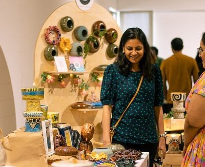 A wide shot of the bustling GLAZED '22 exhibit. We love bringing people together to celebrate handmade art.