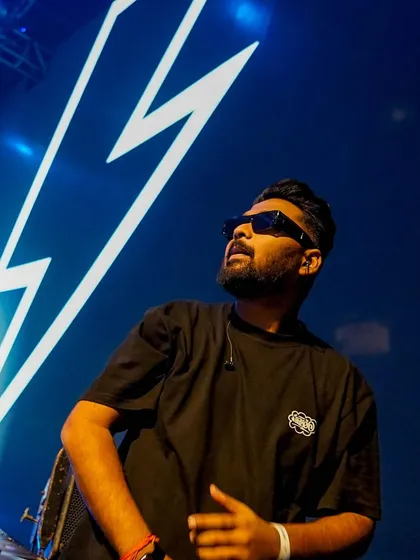 A cool shot from a festival stage, with a lightning bolt graphic on the screen behind me. The energy is always electric.