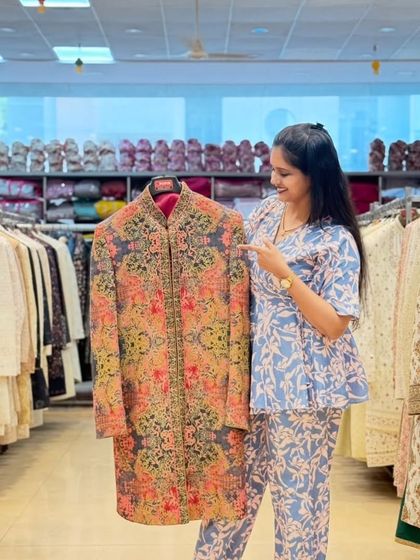 A closer look at the variety in my sherwani collection. This one features vibrant, multi-colored floral embroidery on a dark base, perfect for making a memorable entrance.
