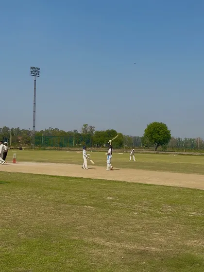 A powerful shot from Captain Aditi during her match-winning innings.