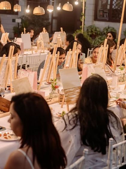 A wide shot of the beautiful outdoor setup for a coffee painting party. The right setting can make the experience even more magical.