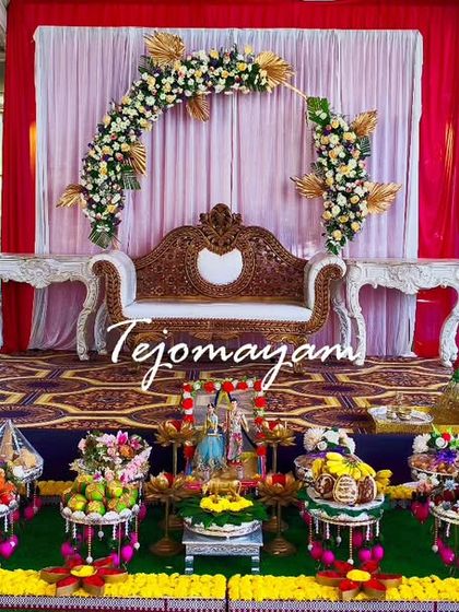 A minimal yet beautiful engagement setup, proving that love is the main highlight. The simple floral arch and small plate arrangement created an intimate and charming setting.