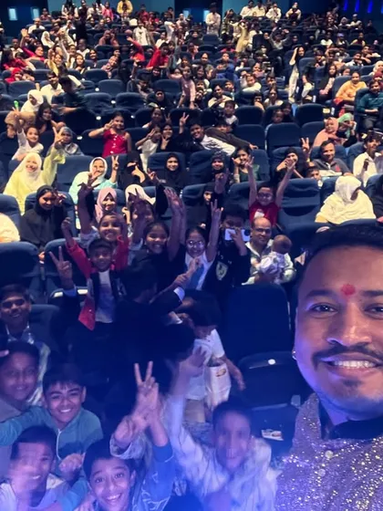 There's no feeling like looking out at a packed theatre full of people ready to be amazed. This selfie captures the massive crowd at a school's annual day function. I feel so blessed to share my passion with so many people.