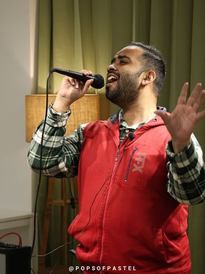 A singer passionately performing for the crowd.