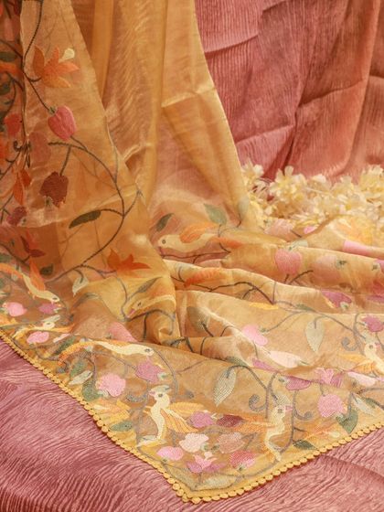 The full pallu of the tissue silk saree, showcasing the artistry of the Paithani embroidery.